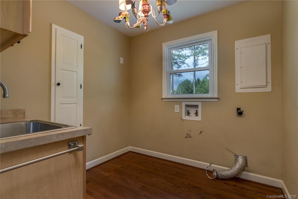 9990 New Cut Road Campobello, SC 29322 - Photo 20 of 31 a room with wooden floor and window