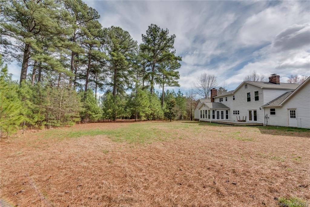 9990 New Cut Road Campobello, SC 29322 - Photo 3 of 31 a front view of a house with a yard