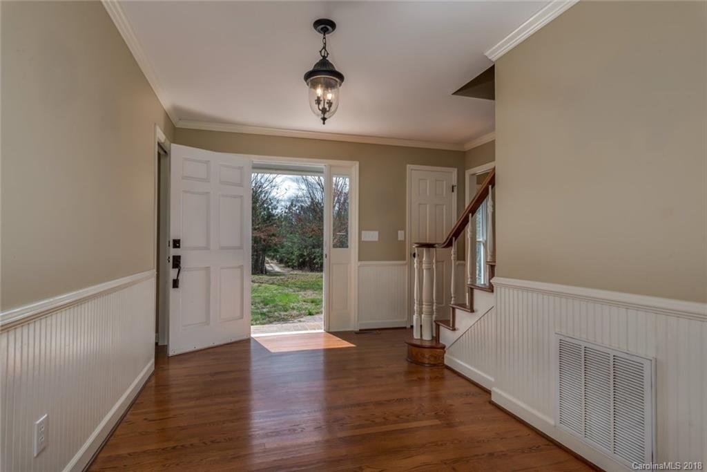 9990 New Cut Road Campobello, SC 29322 - Photo 4 of 31 wooden floor in an empty room with a window