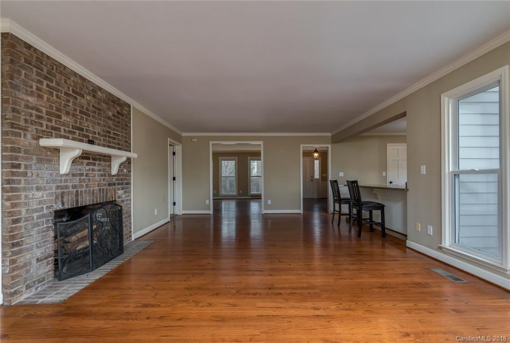 9990 New Cut Road Campobello, SC 29322 - Photo 5 of 31 a view of dining room with furniture wooden floor and a fireplace