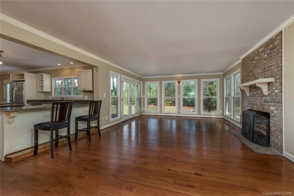 9990 New Cut Road Campobello, SC 29322 - Photo 6 of 31 a view of a livingroom with furniture window and wooden floor