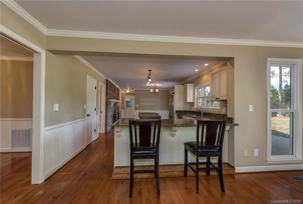 9990 New Cut Road Campobello, SC 29322 - Photo 9 of 31 a view of a dining room with furniture and wooden floor