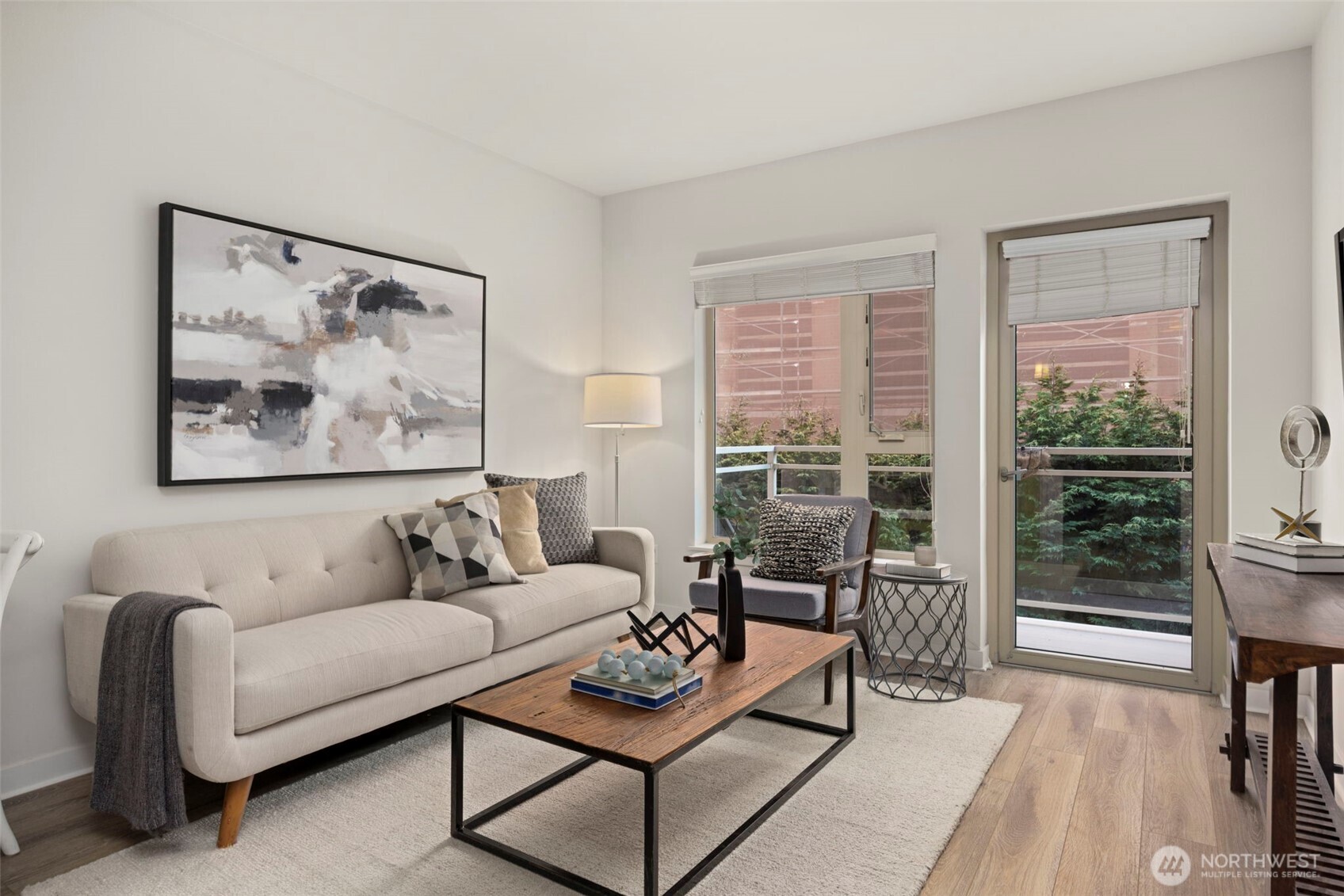 a living room with furniture and a large window with outer view