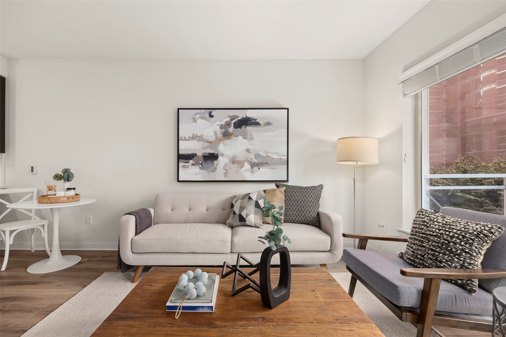 1760 Northwest 56th Street, Unit 309 Seattle, WA 98107 - Photo 12 of 35 a living room with furniture and wooden floor