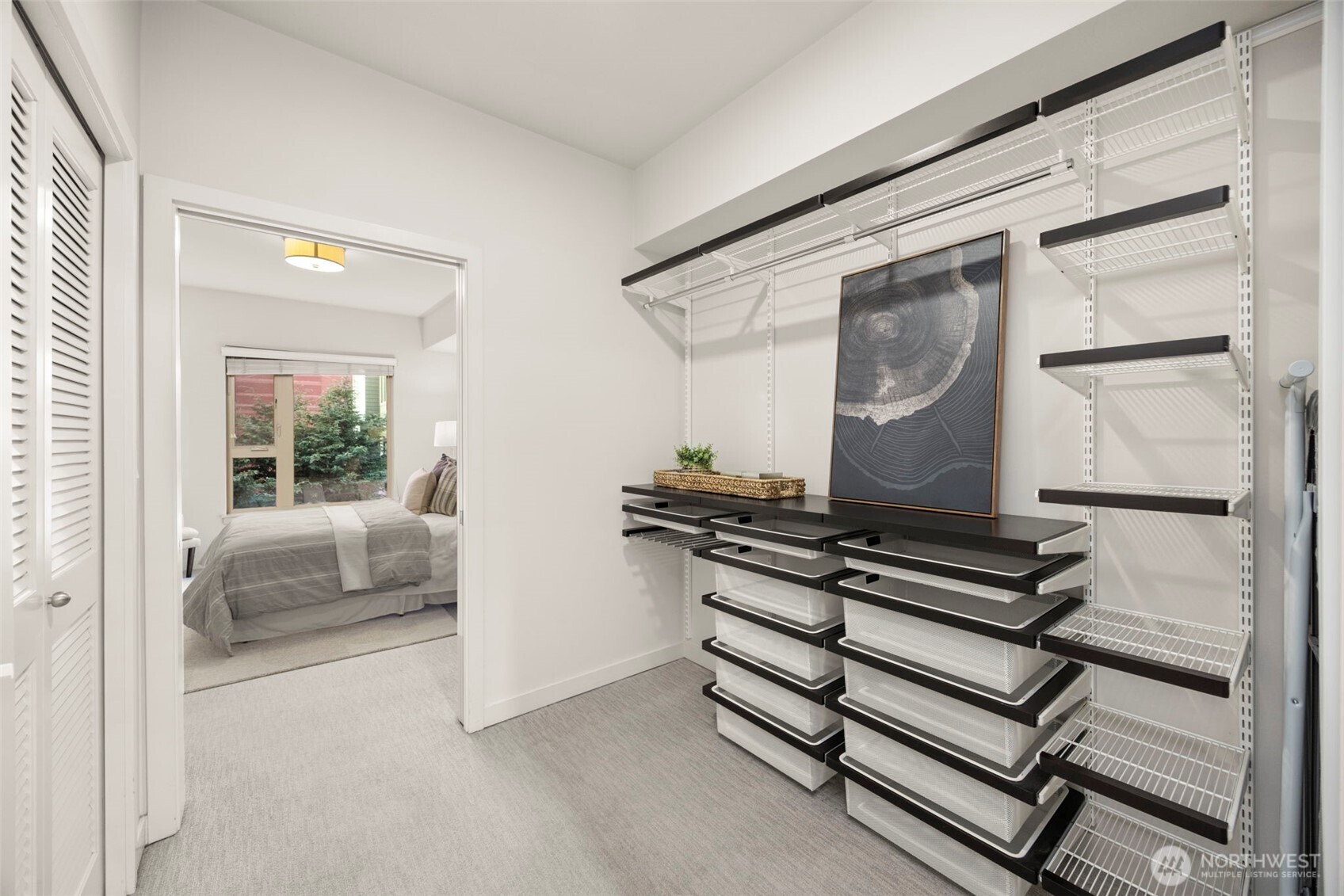 1760 Northwest 56th Street, Unit 309 Seattle, WA 98107 - Photo 19 of 35 a hallway with a couch and a window
