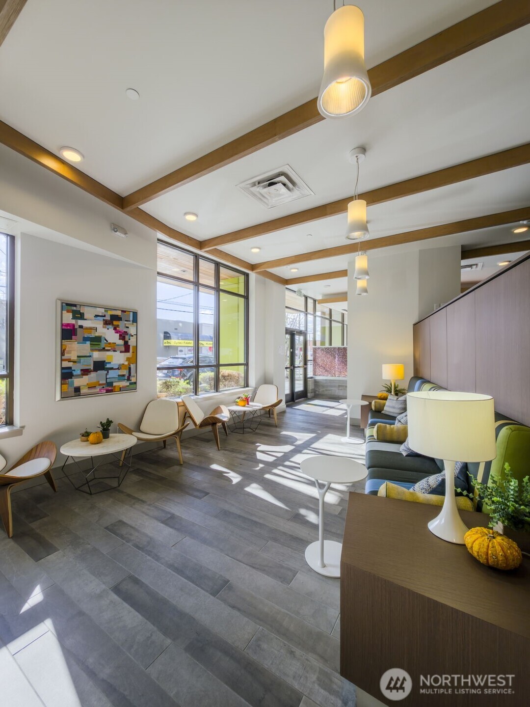 1760 Northwest 56th Street, Unit 309 Seattle, WA 98107 - Photo 30 of 35 a living room with furniture and a lamp