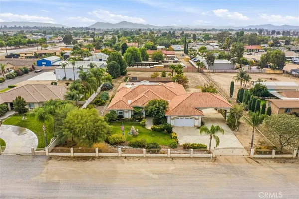 an aerial view of residential houses and outdoor space