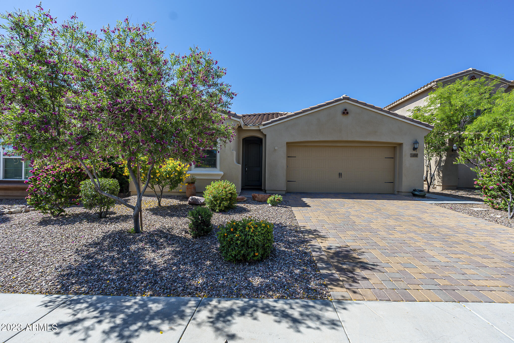 13719 West Linanthus Road Peoria, AZ 85383 - Photo 1 of 38 a front view of a house with a yard and garage