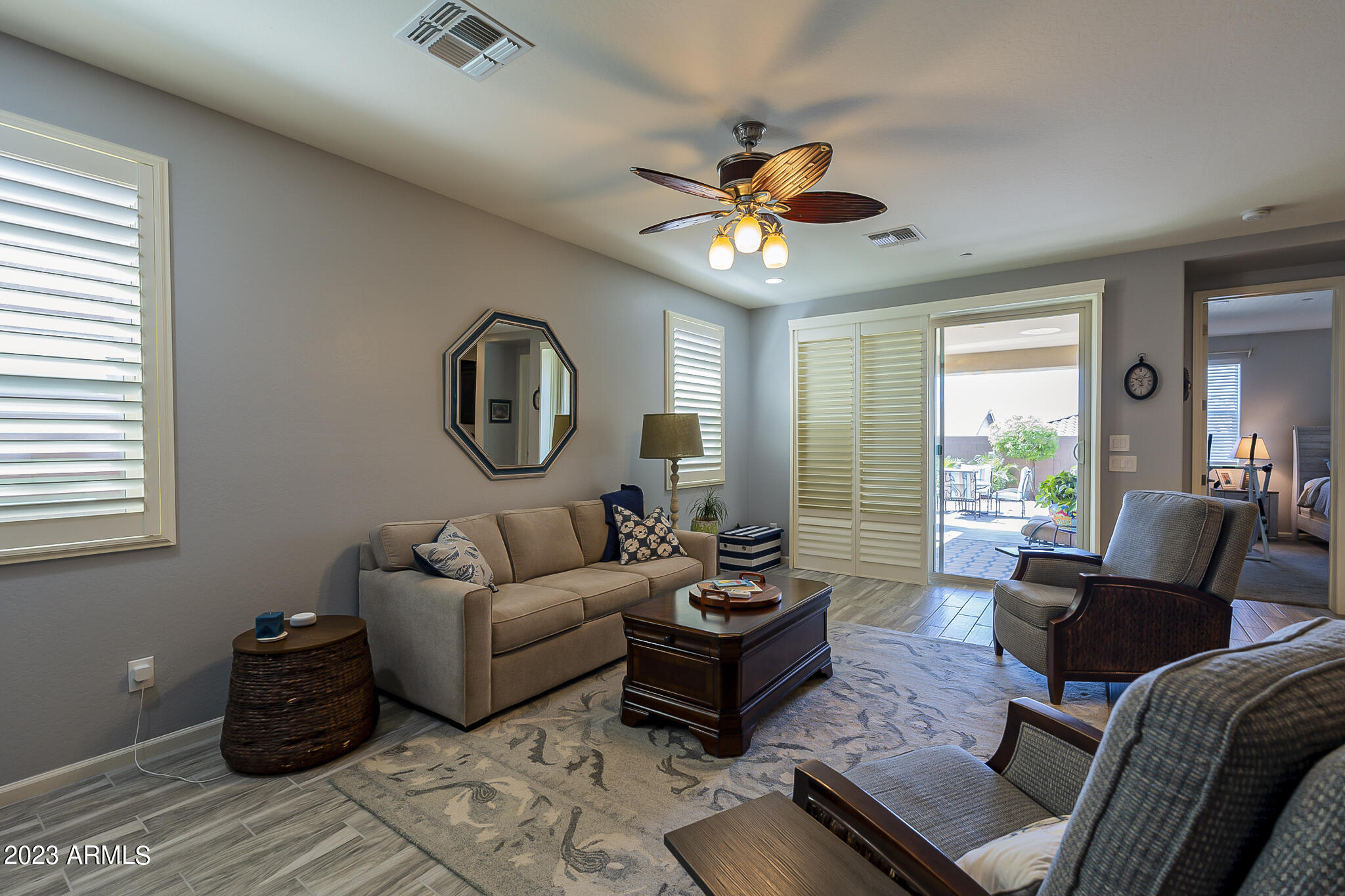 13719 West Linanthus Road Peoria, AZ 85383 - Photo 13 of 38 a living room with furniture and a large window