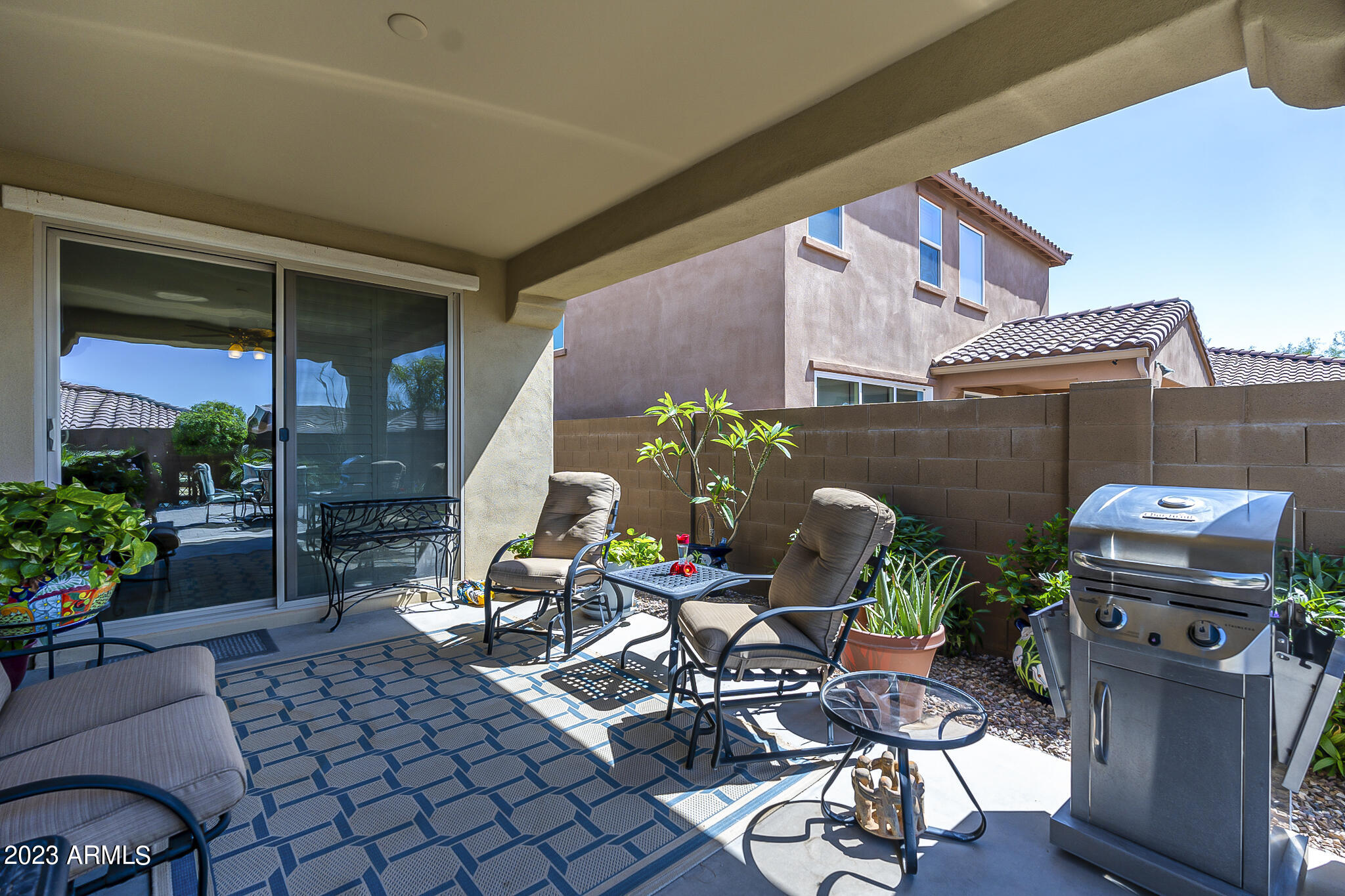 13719 West Linanthus Road Peoria, AZ 85383 - Photo 35 of 38 a backyard of a house with outdoor seating
