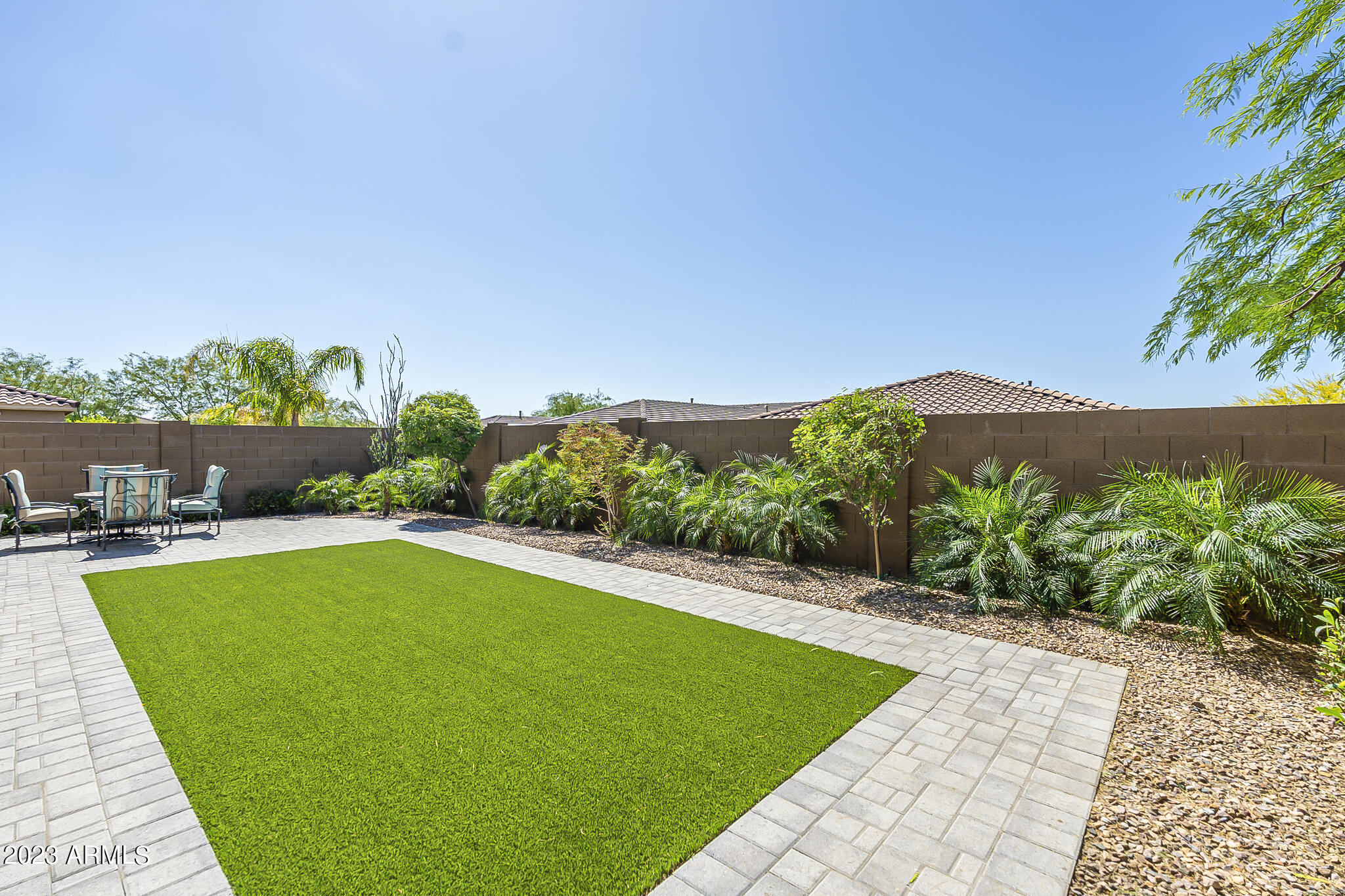 13719 West Linanthus Road Peoria, AZ 85383 - Photo 36 of 38 a view of a swimming pool with a garden