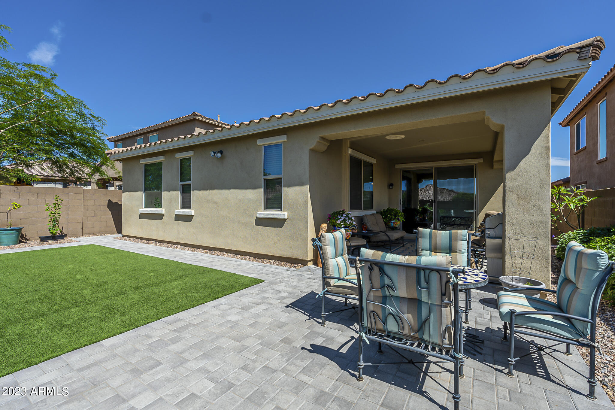 13719 West Linanthus Road Peoria, AZ 85383 - Photo 38 of 38 a view of a house with backyard sitting area and garden