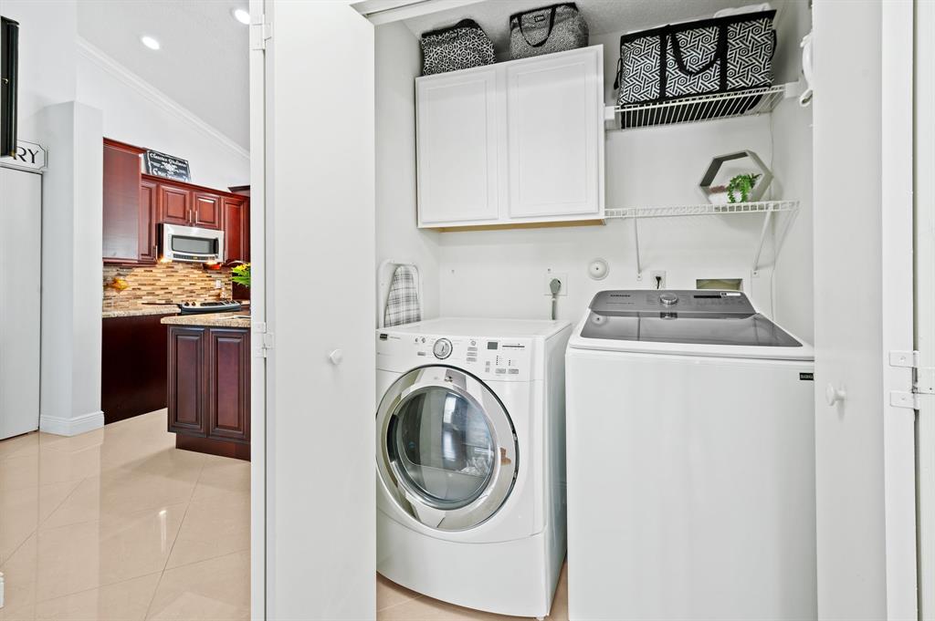 39 Teal Way Boynton Beach, FL 33436 - Photo 16 of 25 a utility room with sink dryer and washer