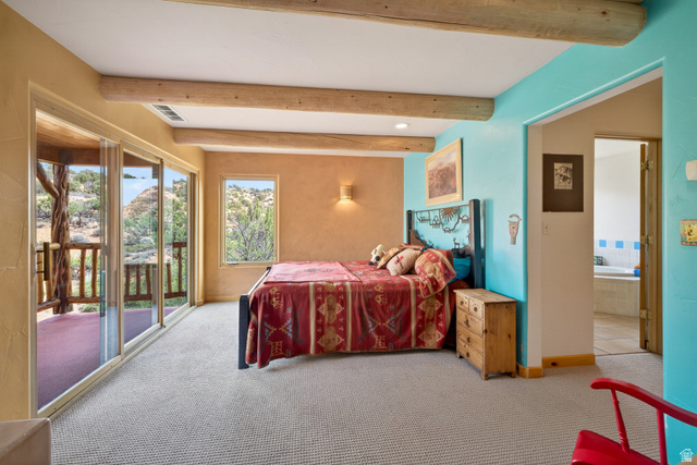 3617 Red Rock Drive Moab, UT 84532 - Photo 50 of 79 Bedroom with beamed ceiling, access to outside, and light carpet