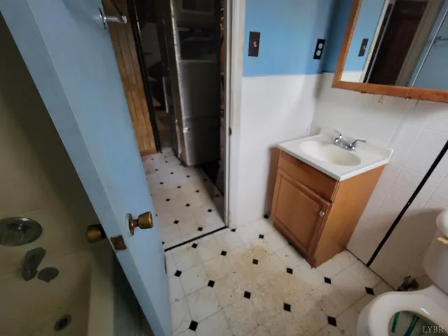 a bathroom with a bathtub and shower
