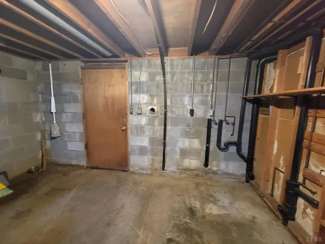 a view of an empty room with a staircase