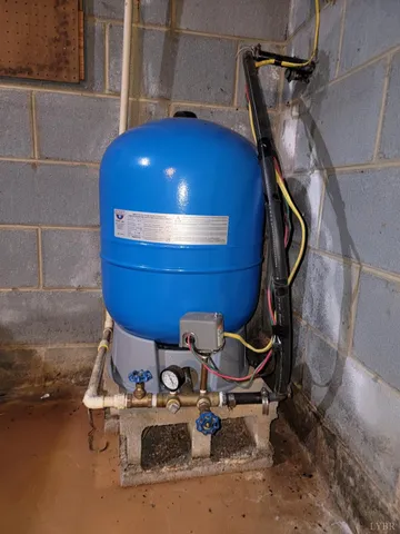 a view of a park with wooden bench and trees