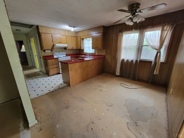 a kitchen with refrigerator and window