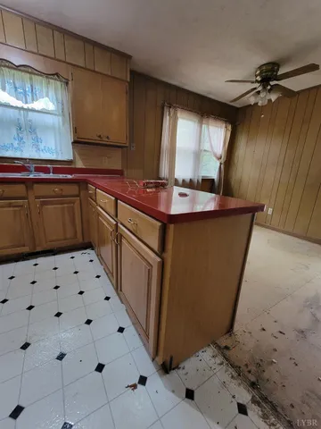 a kitchen with sink a cabinets and window