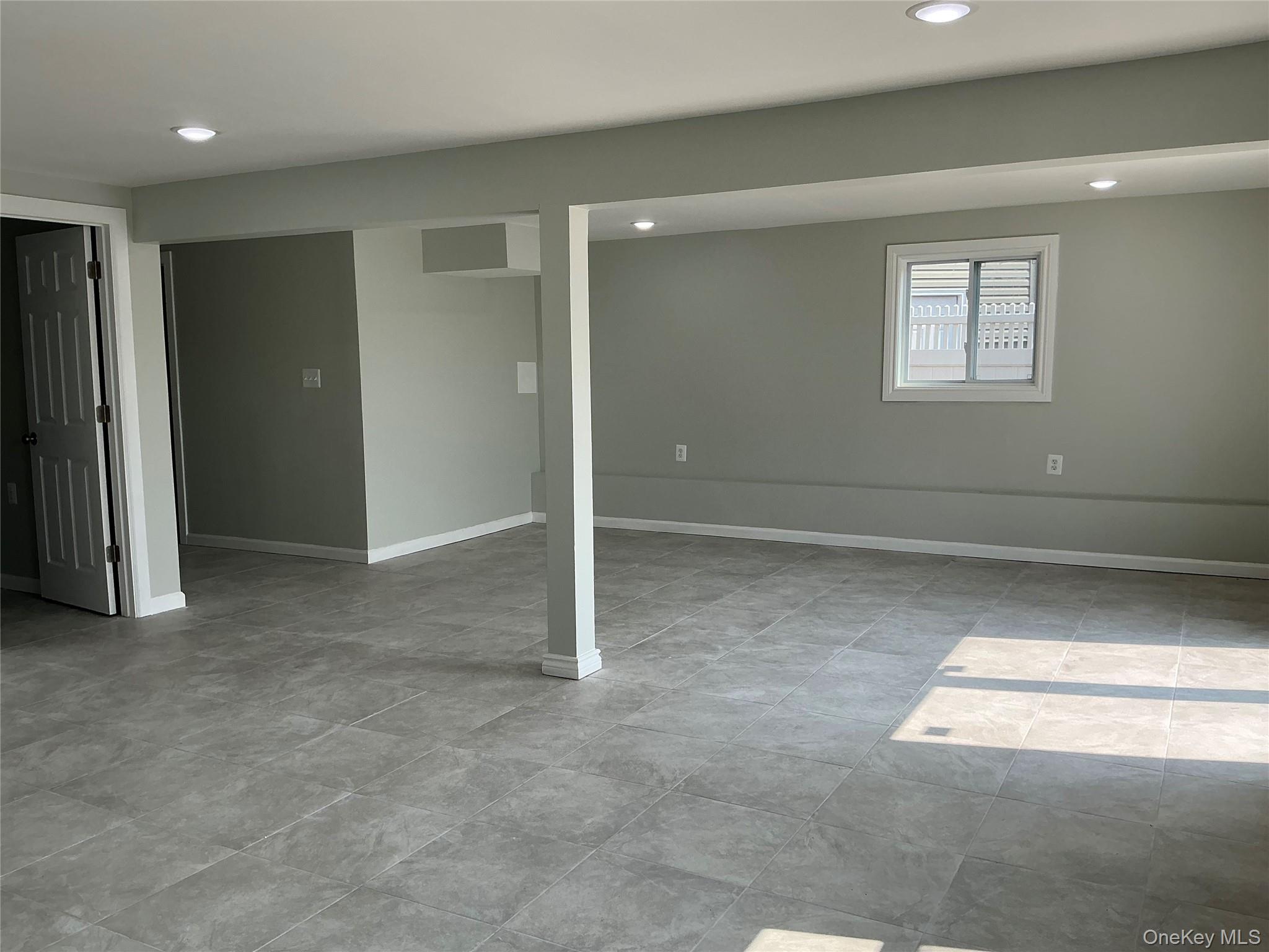 248 East Shore Road Lindenhurst, NY 11757 - Photo 22 of 46 Below grade area featuring recessed lighting and baseboards
