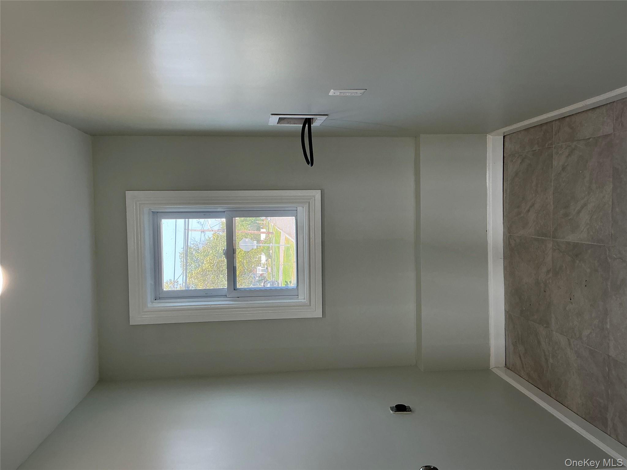 248 East Shore Road Lindenhurst, NY 11757 - Photo 23 of 46 Washroom featuring washer hookup, light tile patterned floors, and electric dryer hookup