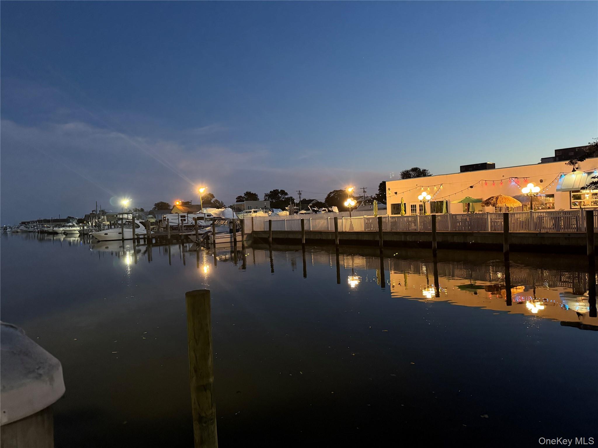 248 East Shore Road Lindenhurst, NY 11757 - Photo 29 of 46 Water view featuring a boat dock