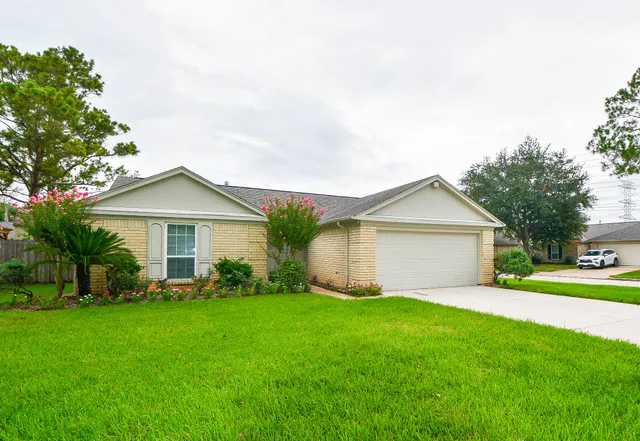 a front view of house with yard and green space