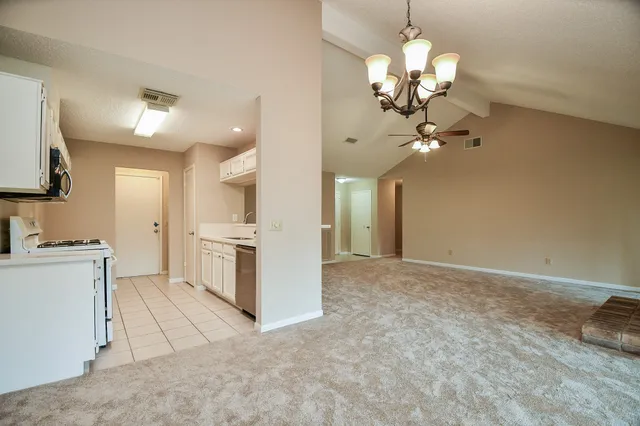 a view of a kitchen with a sink