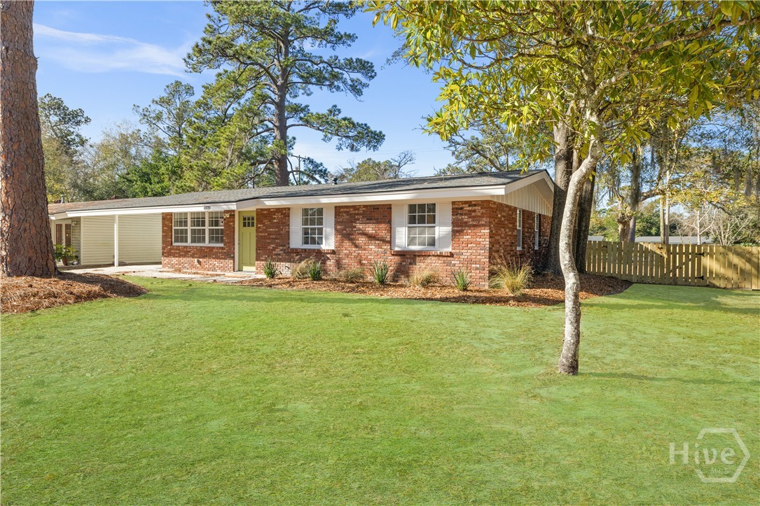 6939 Key Street Savannah, GA 31406 - Photo 2 of 33 Photo Disclaimer: Lawn is currently dormant. Grass color has been digitally enhanced in select photos to illustrate potential appearance during the growing season.