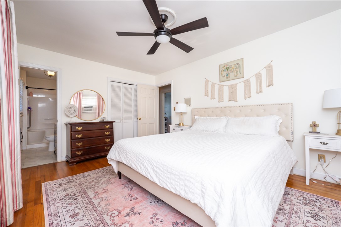 401 South Glassy Mountain Road Pickens, SC 29671 - Photo 15 of 37 This cozy bedroom features hardwood floors and a convenient ceiling fan for comfort.