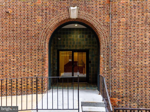 a close view of a sink with a wooden floor
