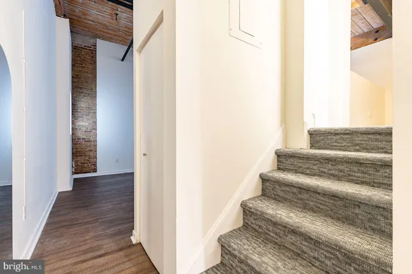 a view of staircase with white walls