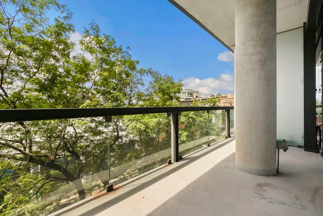 a view of a balcony with an outdoor space