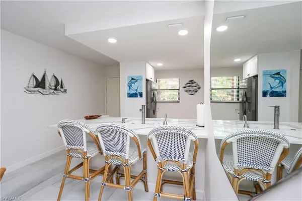a dining room with a table and chairs