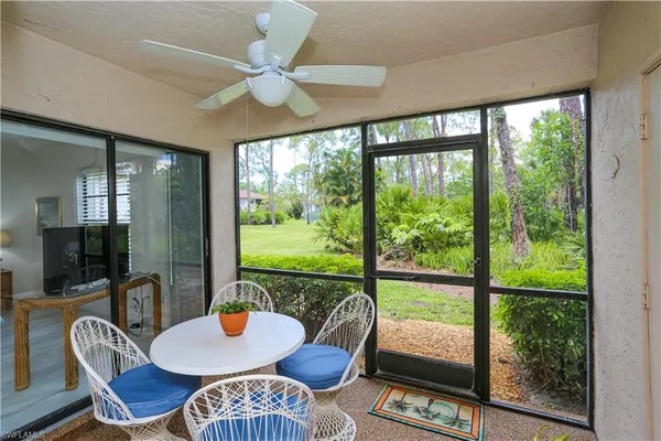 a outdoor dining space with furniture and wooden floor