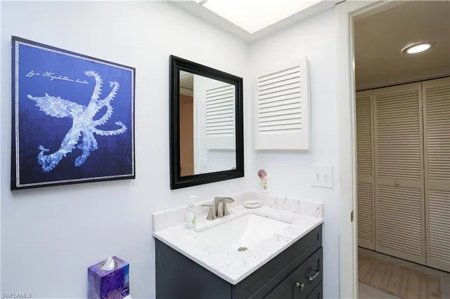 a bedroom with two beds and a window