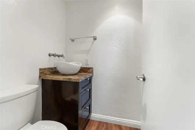 a bedroom with a bed a fireplace and a television