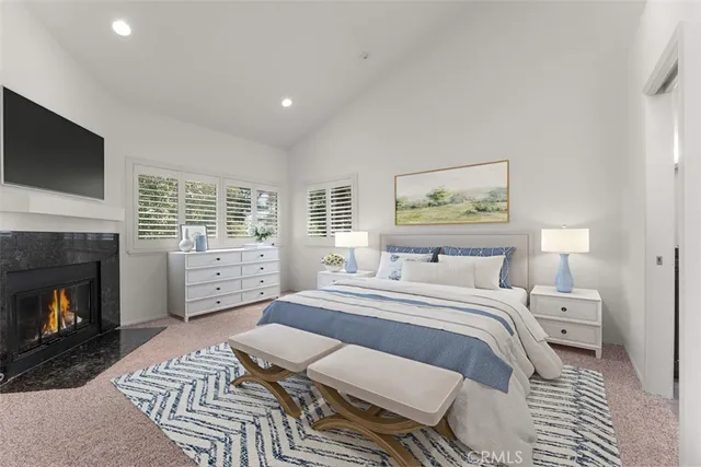 a view of empty room with a fireplace