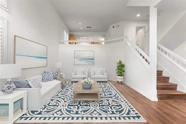 a living room with furniture and a rug