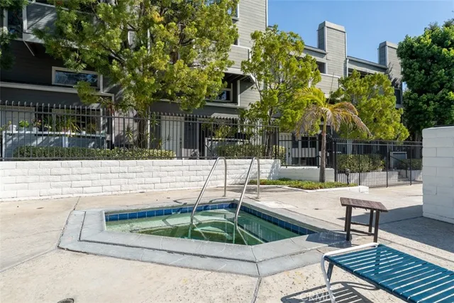 a swimming pool with outdoor seating and yard