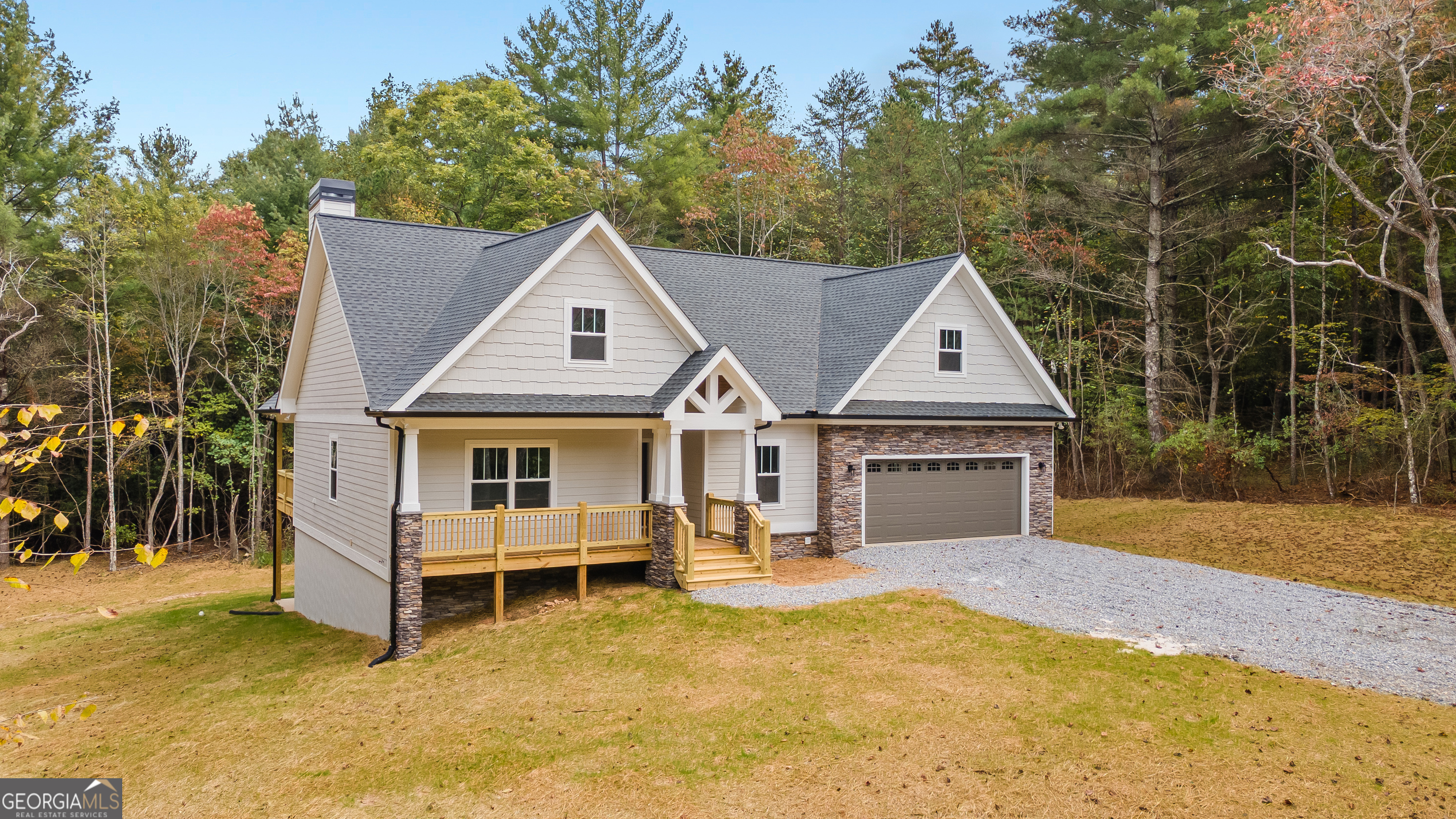 10 Hawks Nest Road, Unit 10 Blairsville, GA 30512 - Photo 2 of 32 a front view of a house with a yard and garage