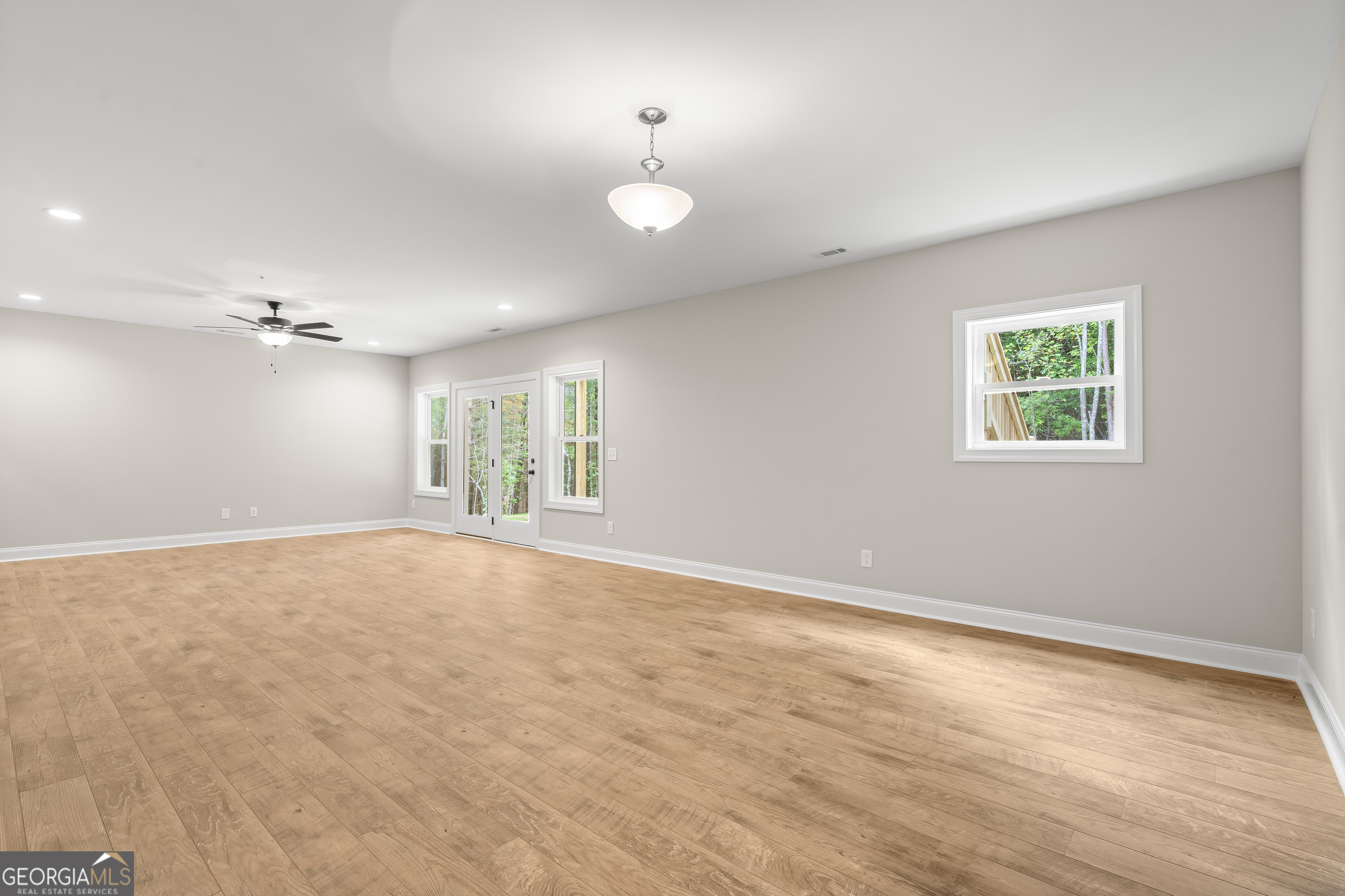 10 Hawks Nest Road, Unit 10 Blairsville, GA 30512 - Photo 30 of 32 wooden floor in an empty room with a window