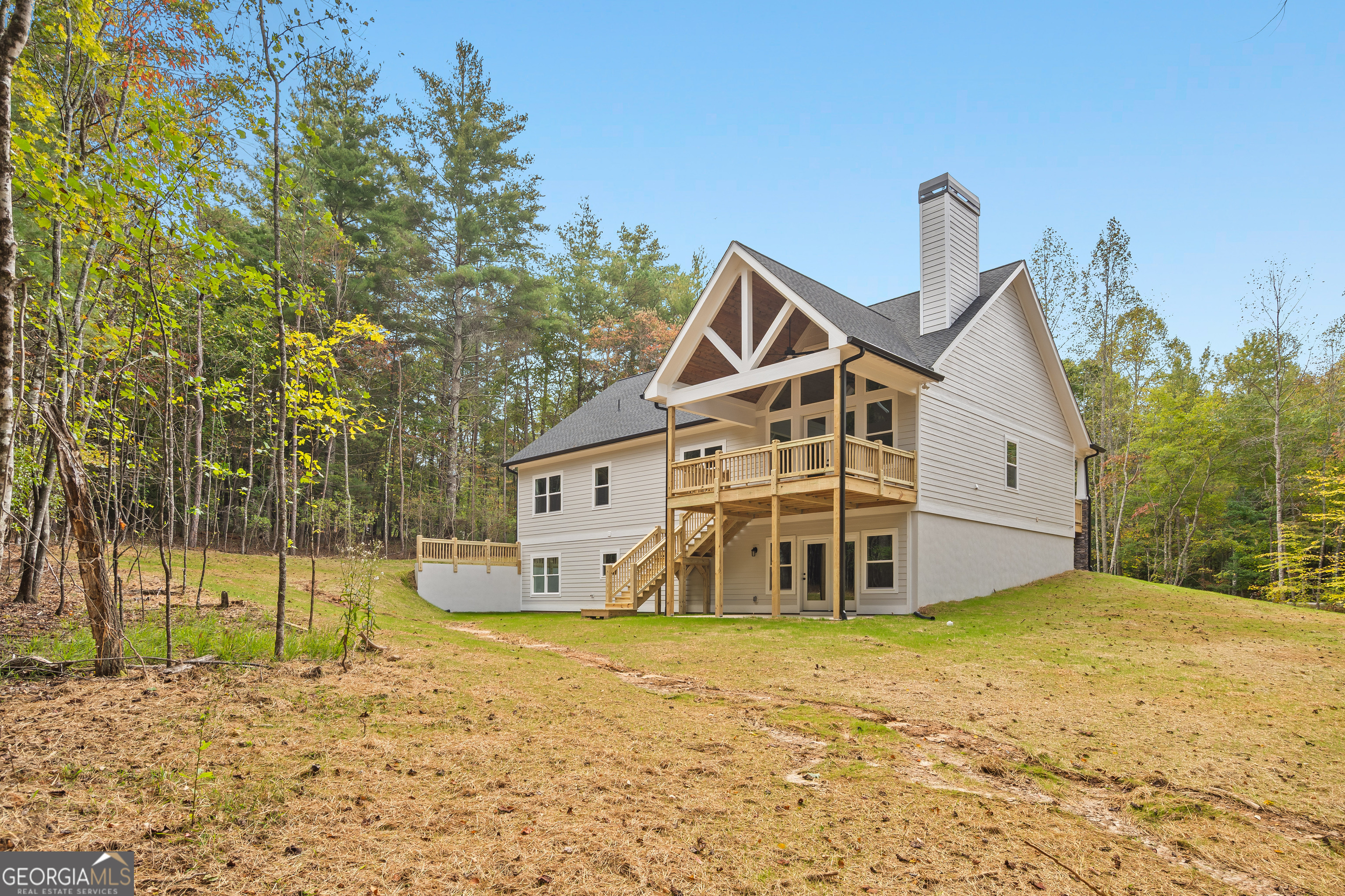 10 Hawks Nest Road, Unit 10 Blairsville, GA 30512 - Photo 4 of 32 a front view of a house with a yard and garage