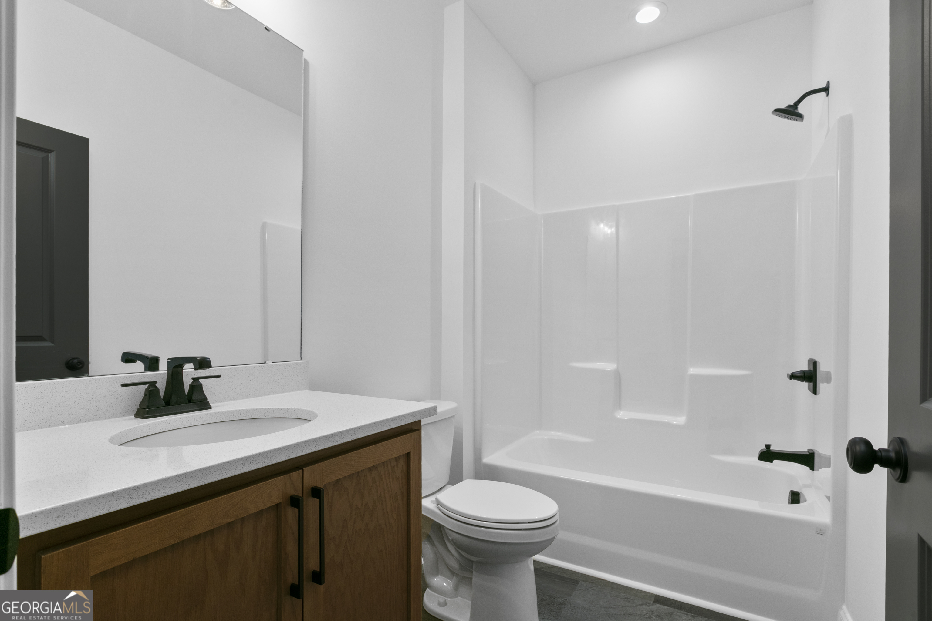 10 Hawks Nest Road, Unit 10 Blairsville, GA 30512 - Photo 9 of 32 a bathroom with a sink a toilet and shower