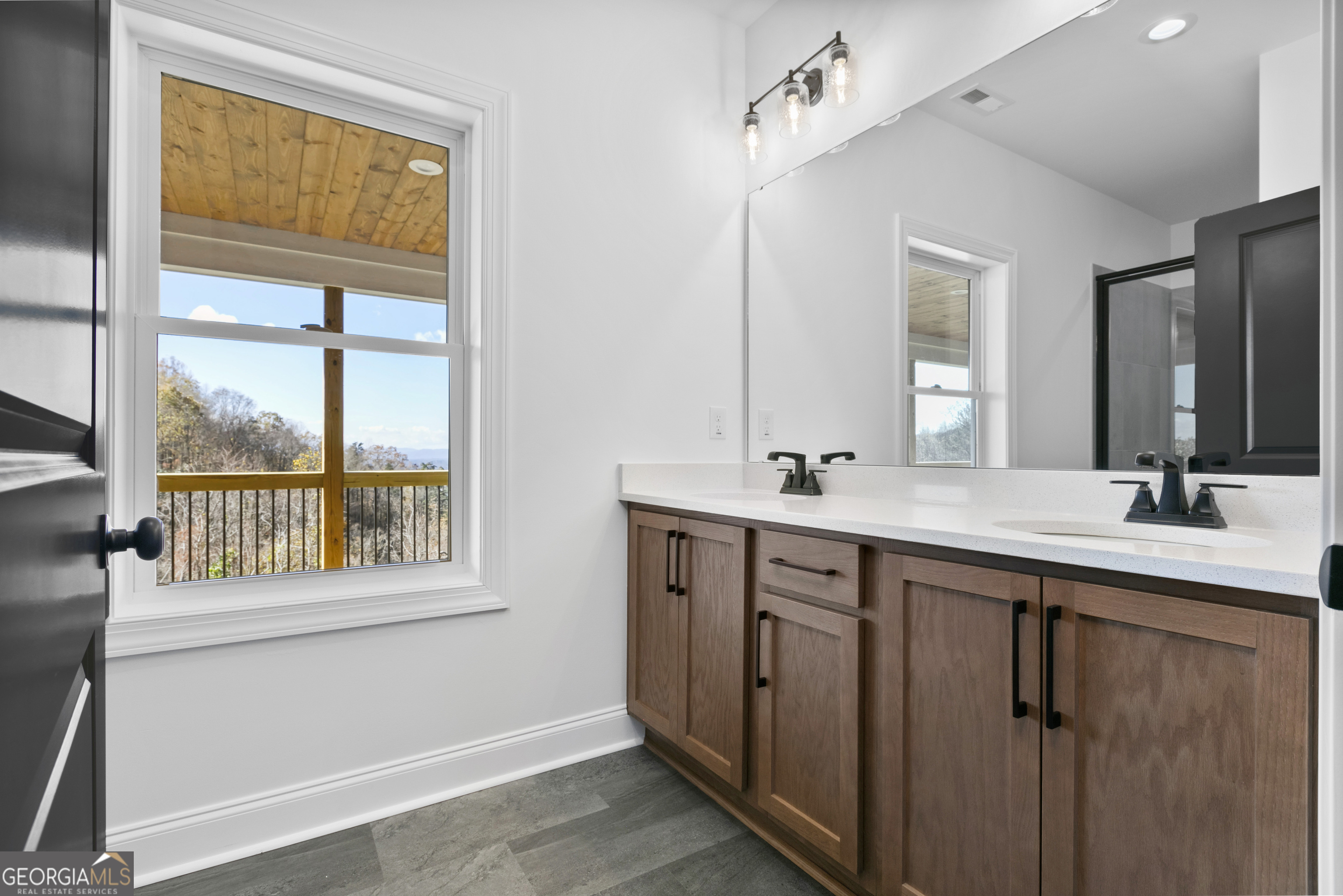 10 Hawks Nest Road, Unit 10 Blairsville, GA 30512 - Photo 10 of 32 a bathroom with a double vanity sink and a large mirror