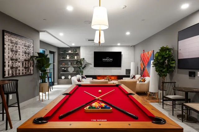 a room with pool table and a flat screen tv