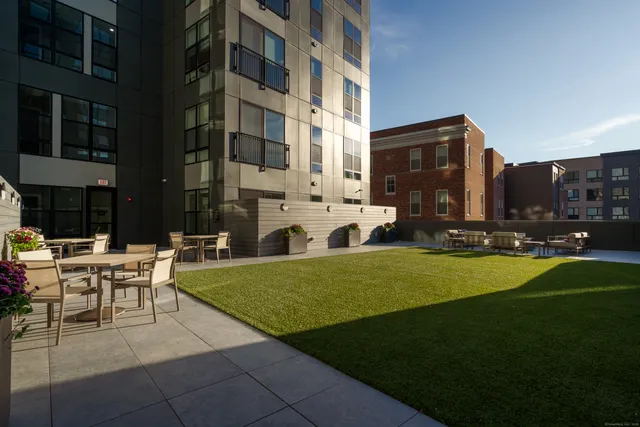 a view of a building with a yard