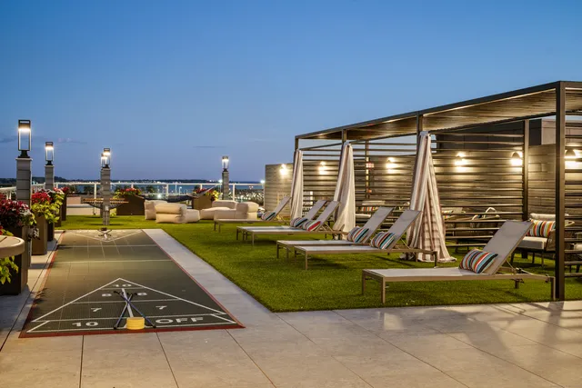 a view of a swimming pool with a lounge chair
