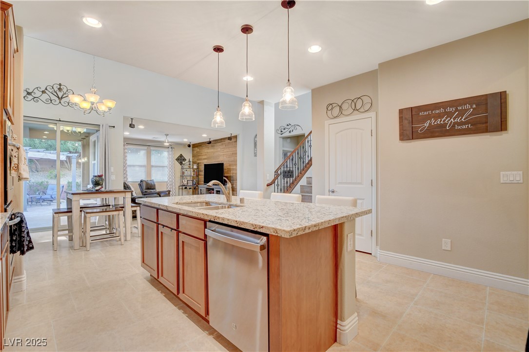 5741 Shadow Bend Drive Las Vegas, NV 89135 - Photo 13 of 78 Kitchen featuring a large fireplace, a center isla