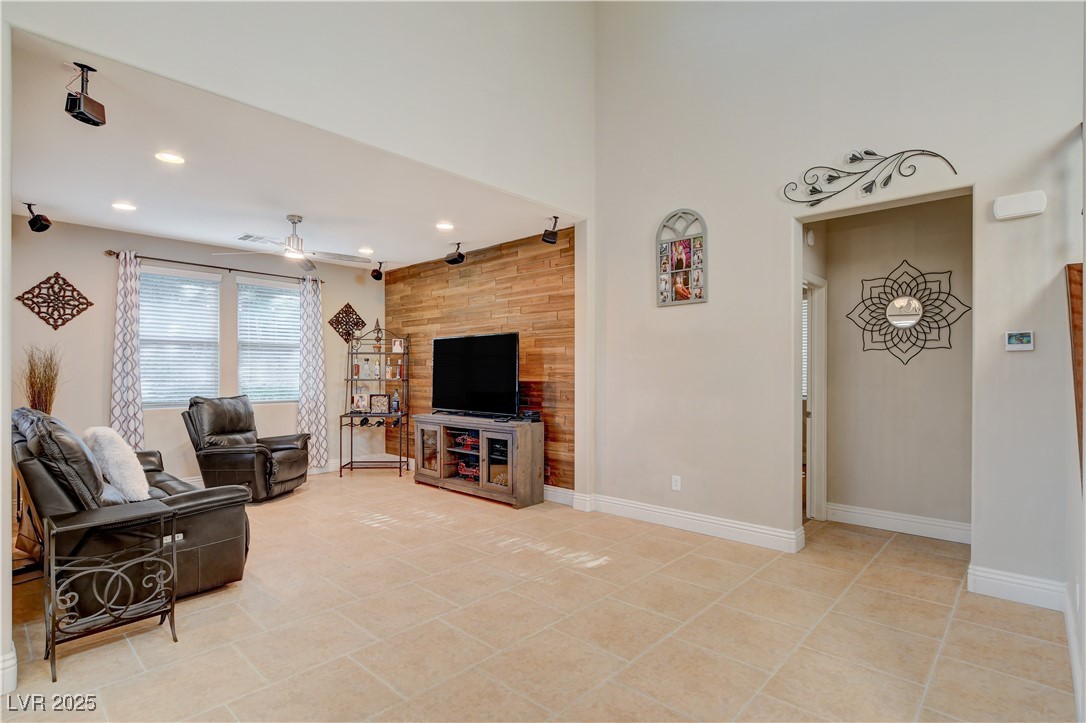5741 Shadow Bend Drive Las Vegas, NV 89135 - Photo 19 of 78 Living room with a ceiling fan, recessed lighting,